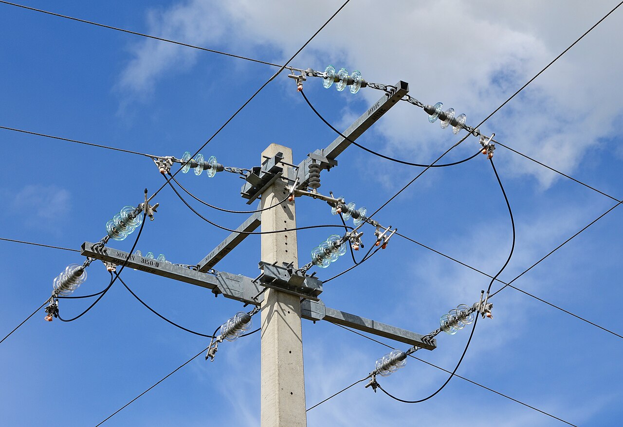 Medium-voltage power lines and glass insulators in Saint-Amant, France