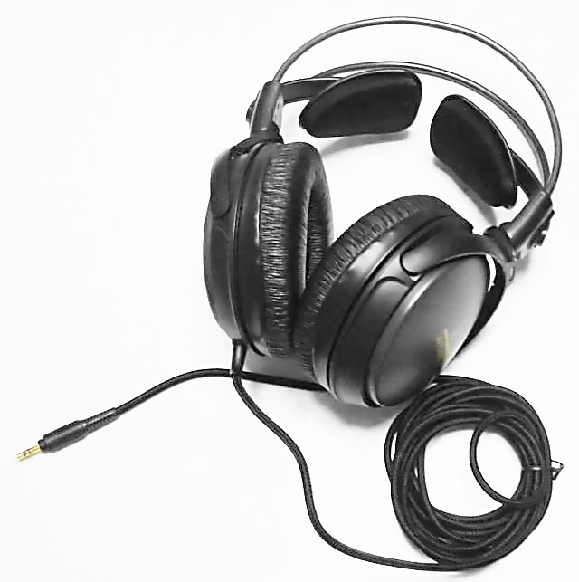 Black wired Audio-Technica headphones against a light background