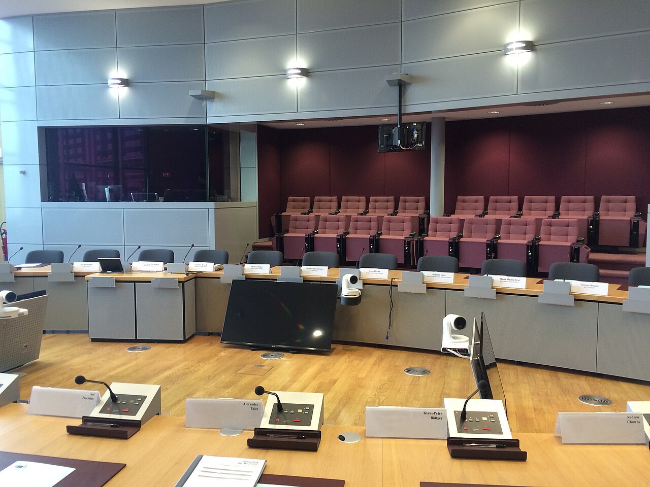 Seats and desks arranged around a government conference room