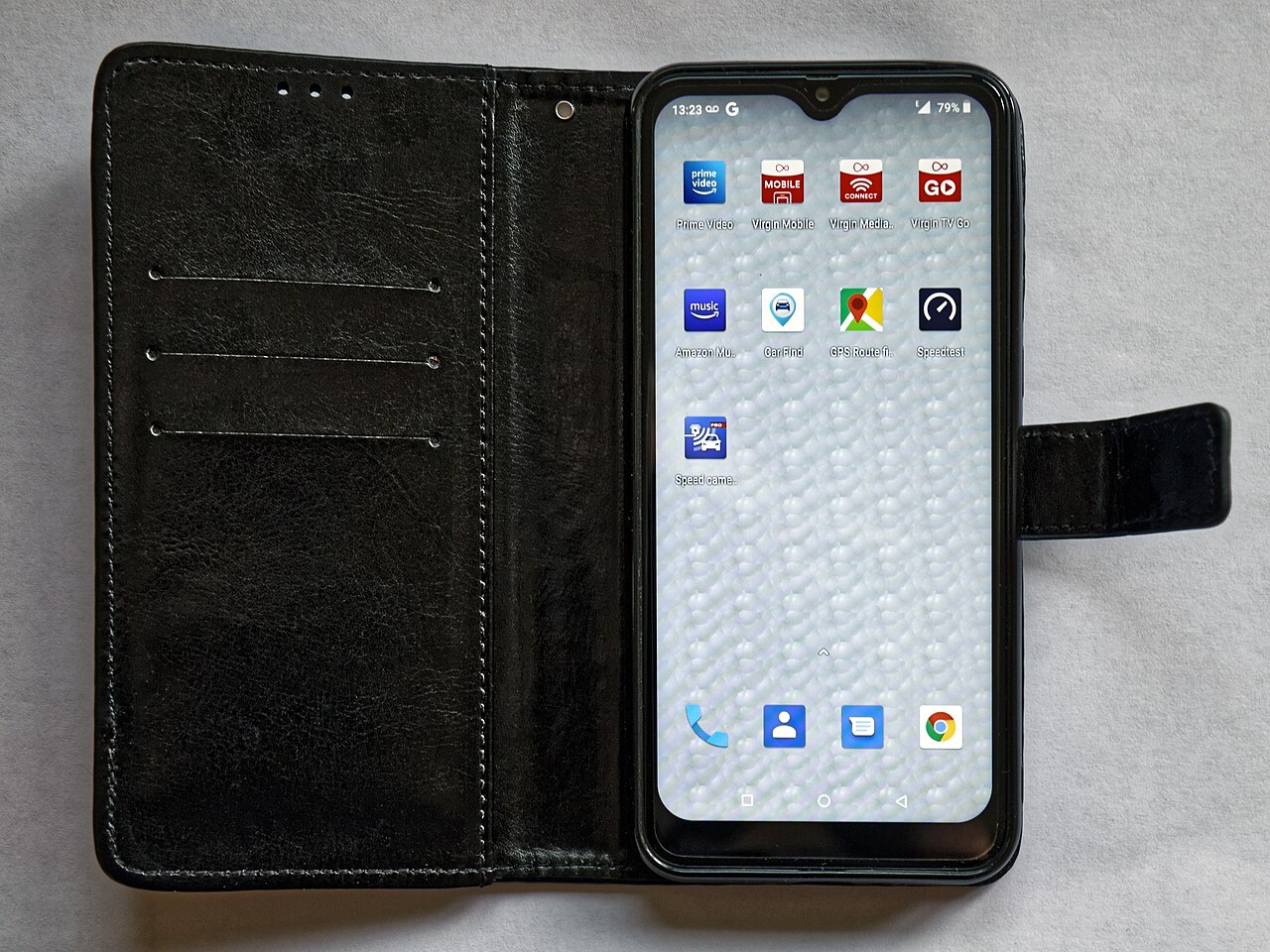 A Blackview smartphone in a black folio case